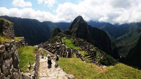 Tourist people at Machu Picchu Inka citadel, Cusco, Auri Peru