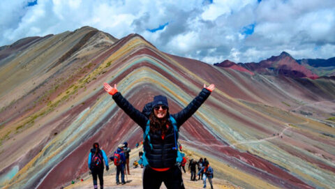 Happy Tourist at Rainbow Mountain Peru