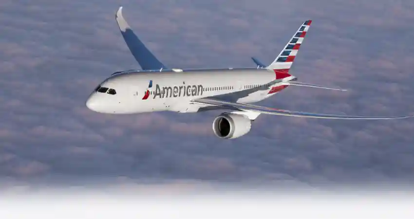 An American Airlines jet flying through the sky, representing flights from Australia to Peru.