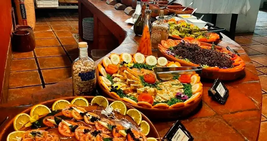 A diverse buffet featuring various dishes at Tinkuy Restaurant, Hotel Sanctuary Lodge.